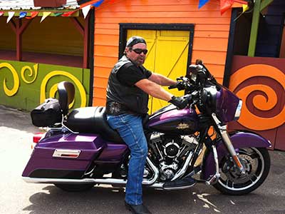 Don Dupuis, a hip implant recipient, on his motorcycle