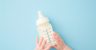 Baby Holding Baby Bottle