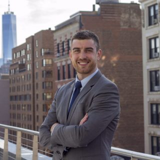 man in a suit in a city