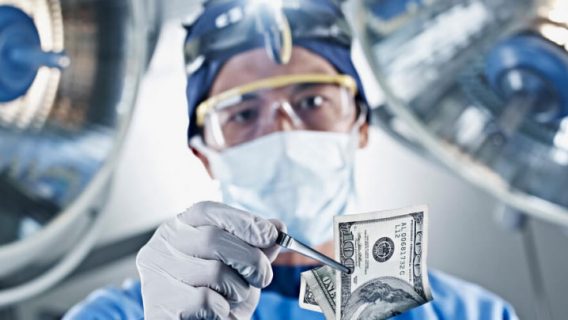 Hernia mesh surgeon holding money