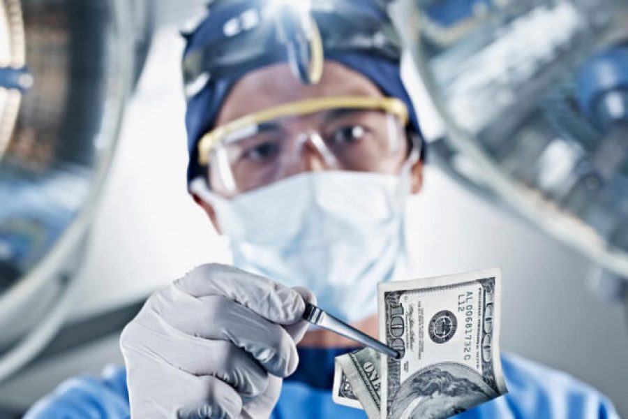 Hernia mesh surgeon holding money
