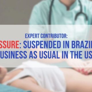 young pained woman receiving an abdominal exam