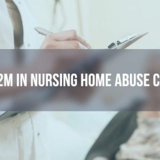 doctor taking notes with an elderly female patient