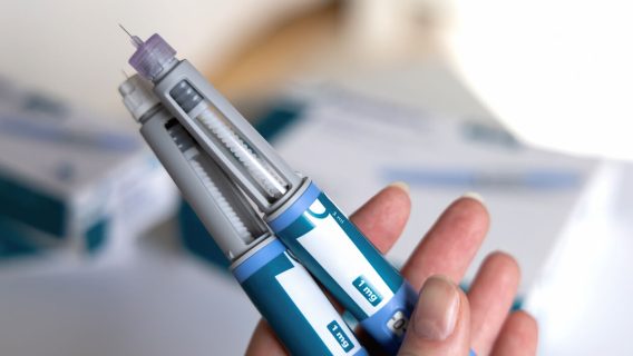 Woman holding two ozempic pens