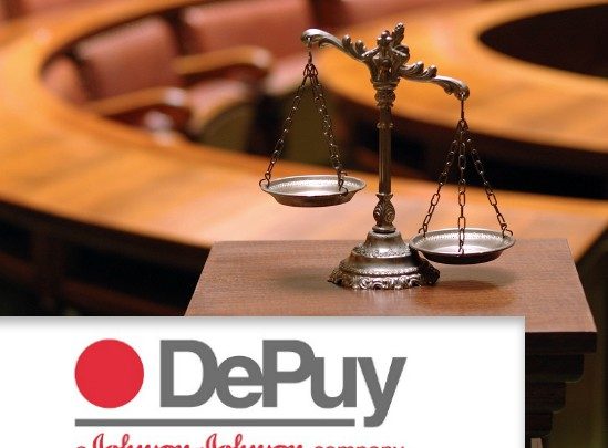 Second DePuy ASR Hip Implant Trial Scales in coutroom and DePuy logo