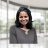 Professional headshot of Shirley Samuel-Abraham, Ph.D., a distinguished cancer immunologist, smiling in a modern, well-lit indoor setting.