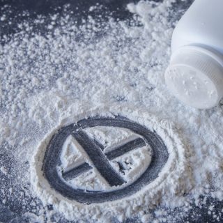 Talcum powder with cross sign