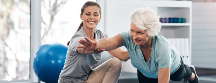 Elderly woman receiving physical therapy