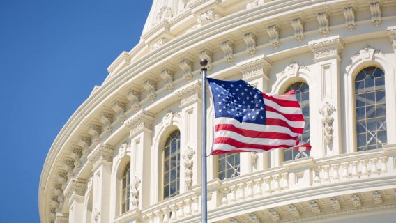 U.S. Capitol exterior with flag
