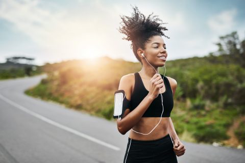 Woman exercising while running outside