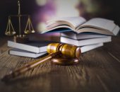 Legal textbooks, justice scales and gavel