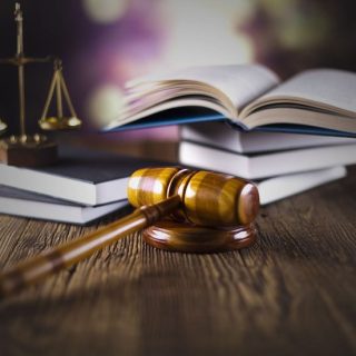 Legal textbooks, justice scales and gavel