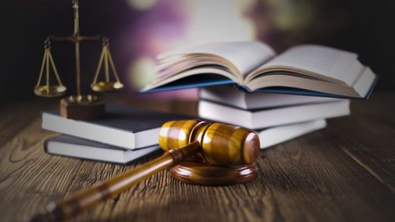 Legal textbooks, justice scales and gavel