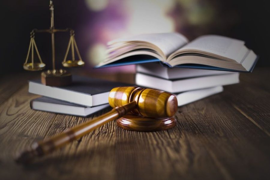 Legal textbooks, justice scales and gavel