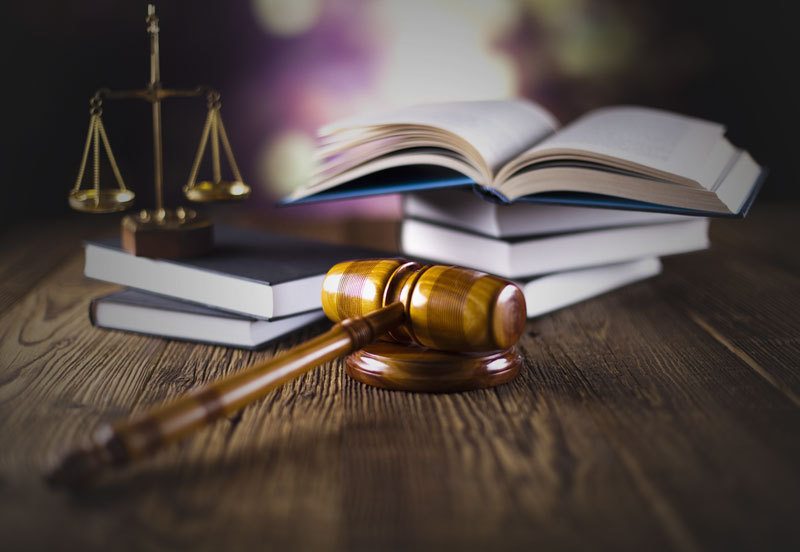 Legal textbooks, justice scales and gavel