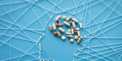 human head made out of pins and threads with antidepressants shaping the brain