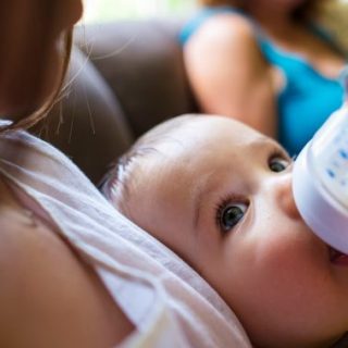 Baby being fed with a bottle