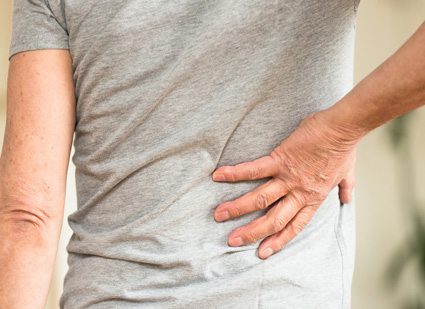 Man Grabbing Back in Pain
