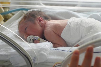 Newborn Baby in Hospital Cart