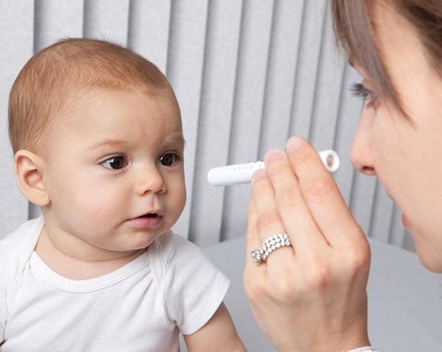 Baby receiving an eye exam