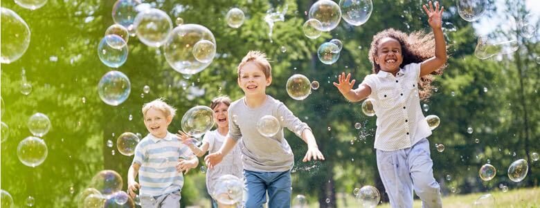 children playing with bubbles