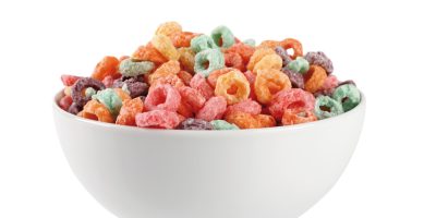 Bowl of brightly colored fruit-flavored breakfast cereal