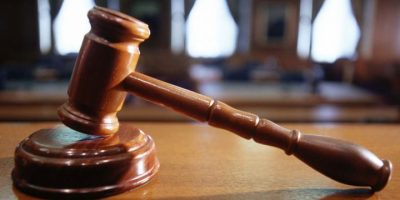 closeup of a gavel in a courtroom