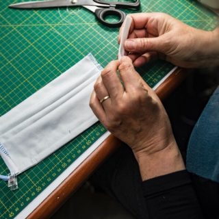 Person making a cloth face mask