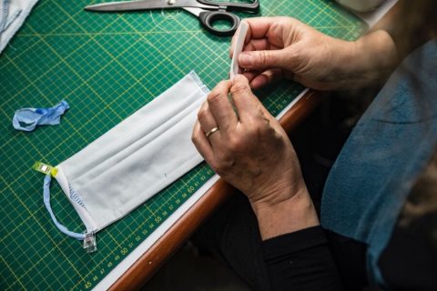 Person making a cloth face mask