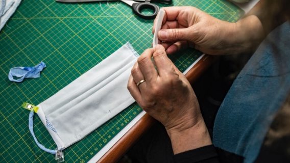 Person making a cloth face mask