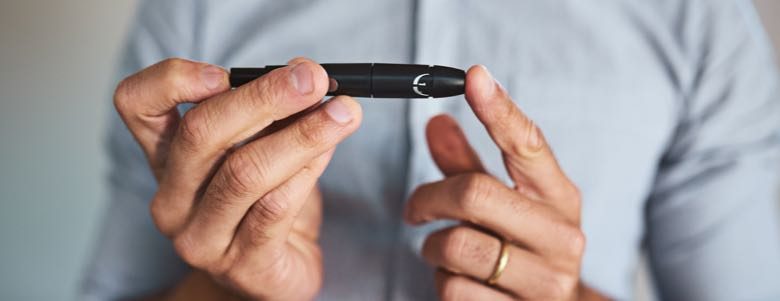Man giving himself a prick test