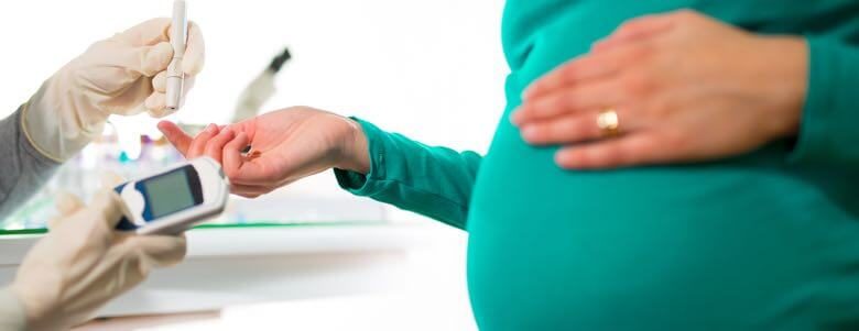 Pregnant woman taking a prick test