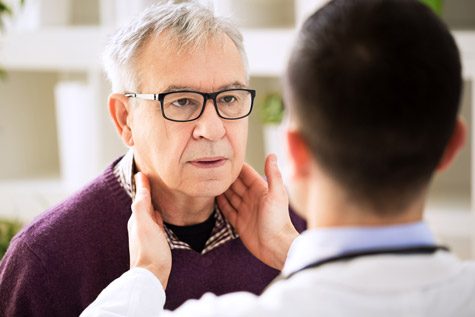 Doctor examining lymph nodes