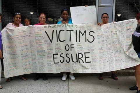 Essure victims hold sign