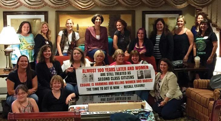 large group of women protesting Essure in a living room