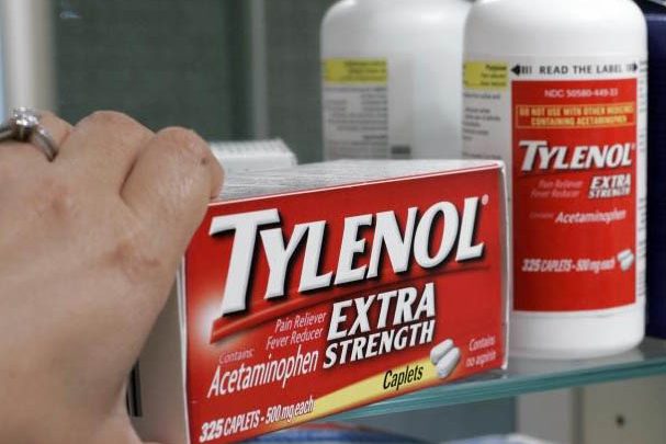 FDA warns doctors about liver damage from too much acetaminophen Hand reaching for box of Tylenol