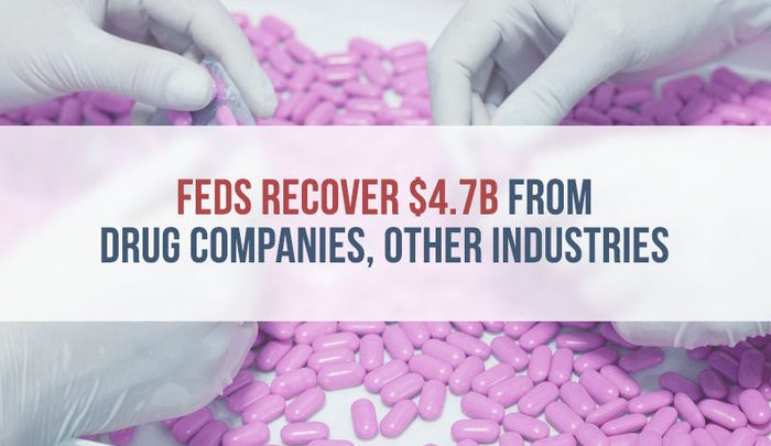 gloved hands sorting pink pills gloved hands sorting pink pills