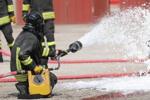 Firefighter using foam