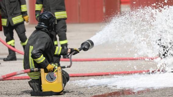 Firefighter using foam