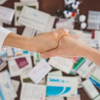 Shaking Hands over Prescription Drugs