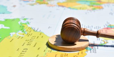 Judge's gavel resting on a map of the United States