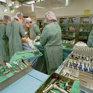 Operation room with doctors completing Hip Surgery