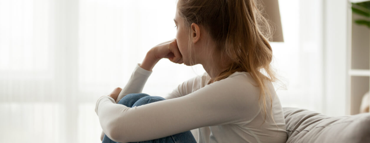 Girl staring out window