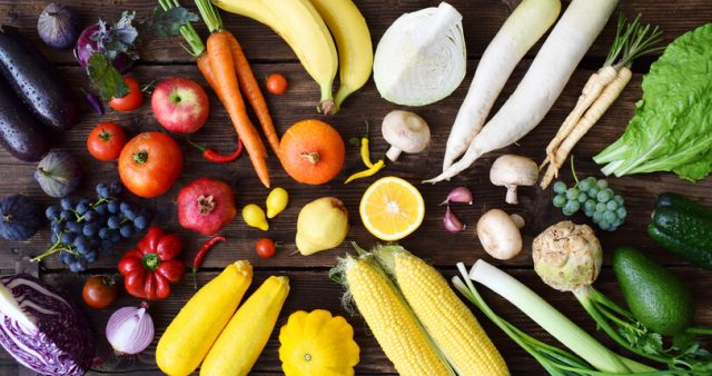 Fruits and vegetables laid out on table