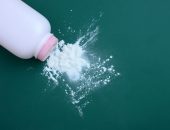 Talcum powder spilling out of bottle