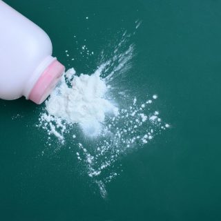 Talcum powder spilling out of bottle
