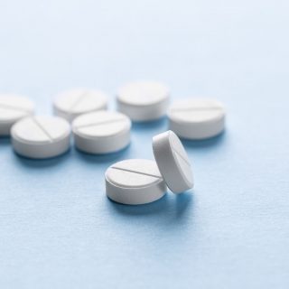 Generic pills scattered on surface