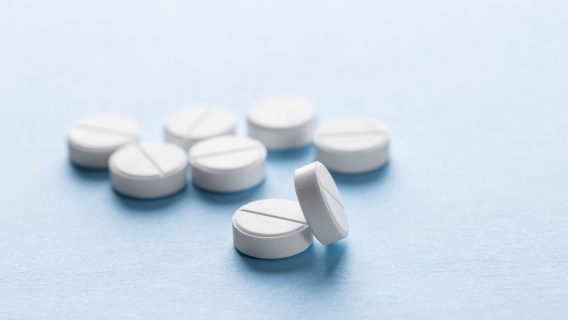 Generic pills scattered on surface