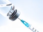 Syringe drawing from a vial