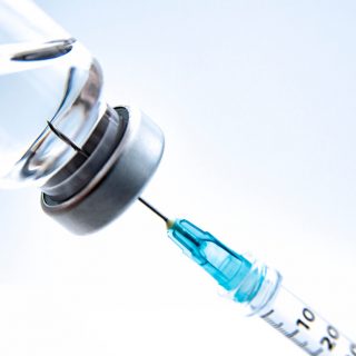 Syringe drawing from a vial